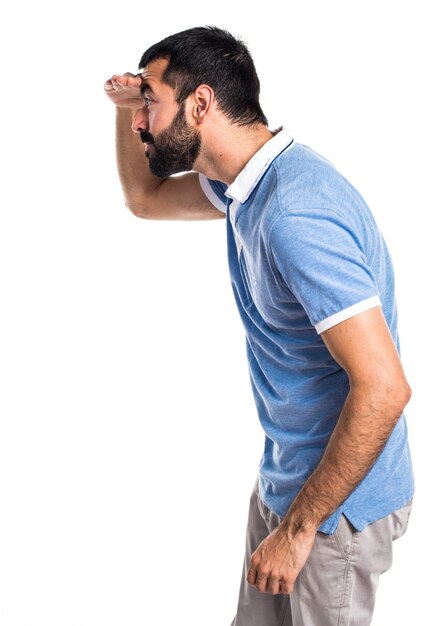 Man with blue shirt showing something