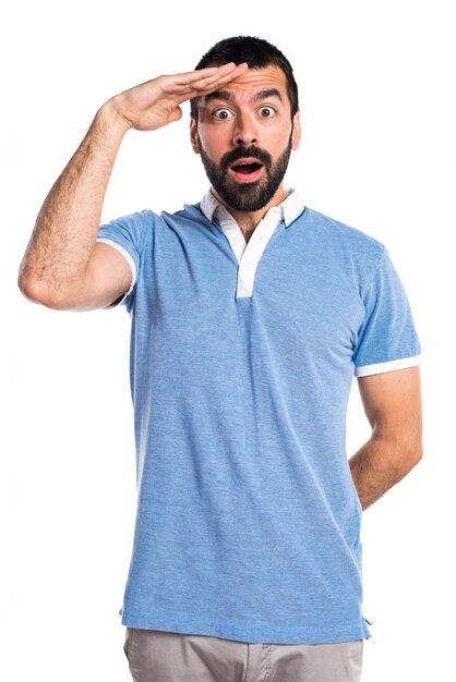 Man with blue shirt showing something