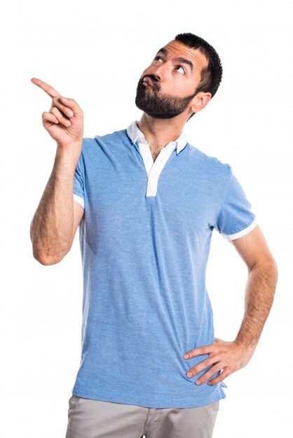 Man with blue shirt thinking