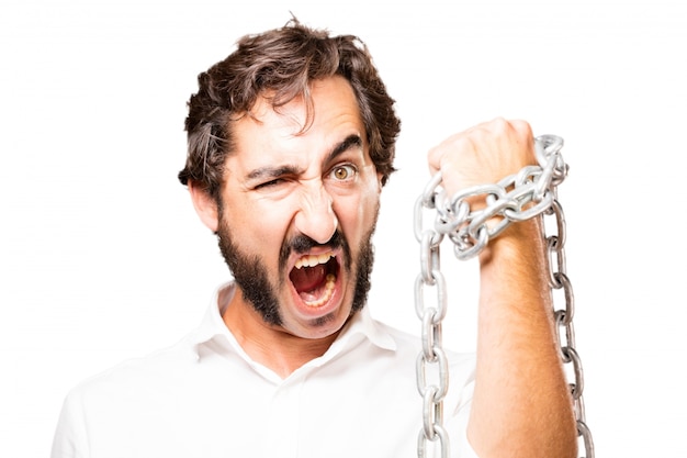 Free photo man with a chain around his fist and screaming