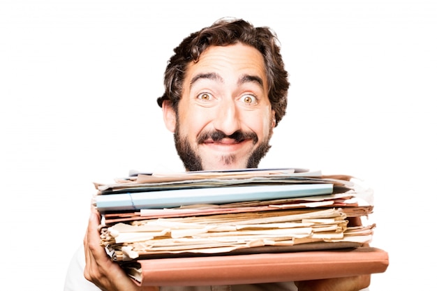 Man with a filing cabinet and a stack of papers