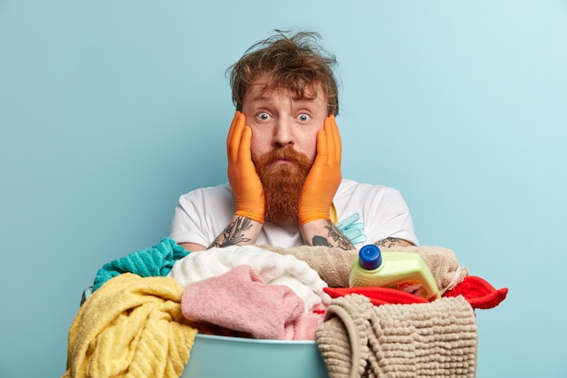 Man with ginger beard doing laundry