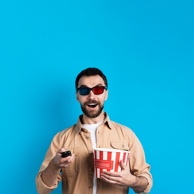 Man with glasses and remote control