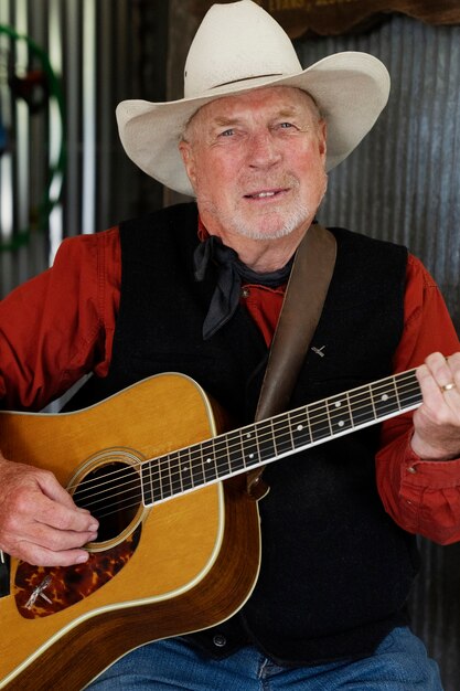 Man with guitar getting ready for country music concert