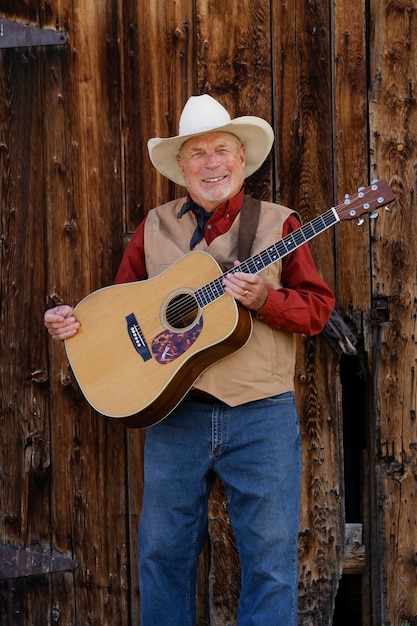 Free photo man with guitar getting ready for country music concert