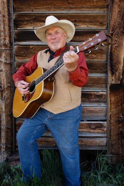 Man with guitar getting ready for country music concert