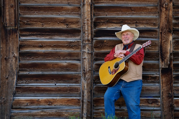 Free photo man with guitar getting ready for country music concert