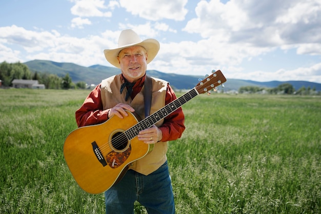 Free photo man with guitar getting ready for country music concert