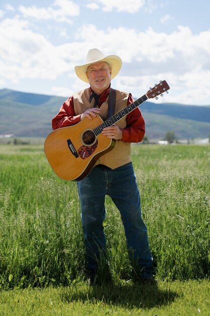 Man with guitar getting ready for country music concert