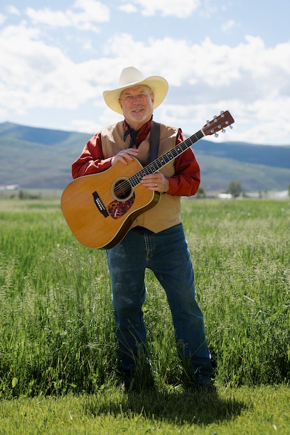 Man with guitar getting ready for country music concert