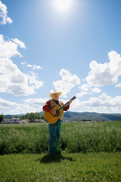 Man with guitar getting ready for country music concert