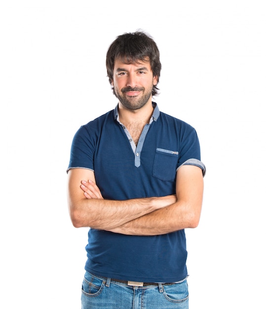 Man with his arms crossed over white background