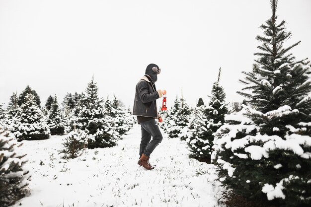 Man with lantern walking in nature