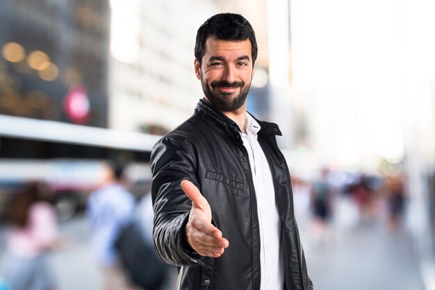 Man with leather jacket making a deal