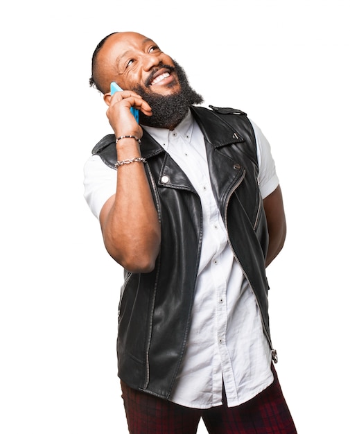 Man with leather waistcoat talking on the phone