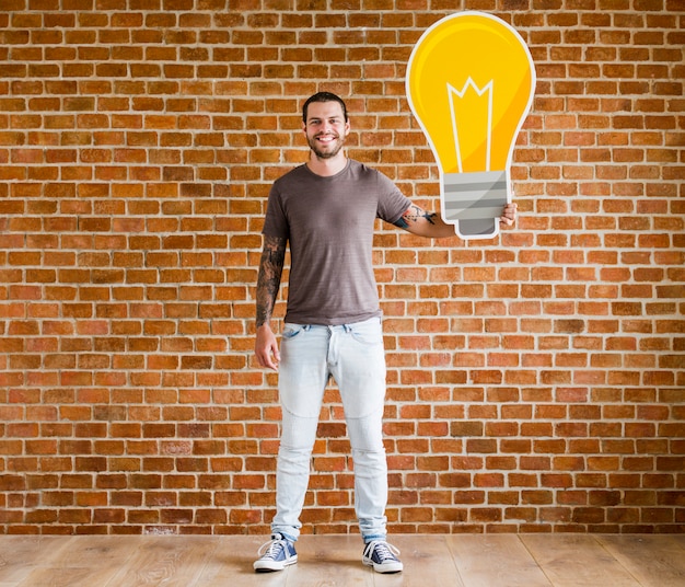 Free Photo man with a light bulb icon