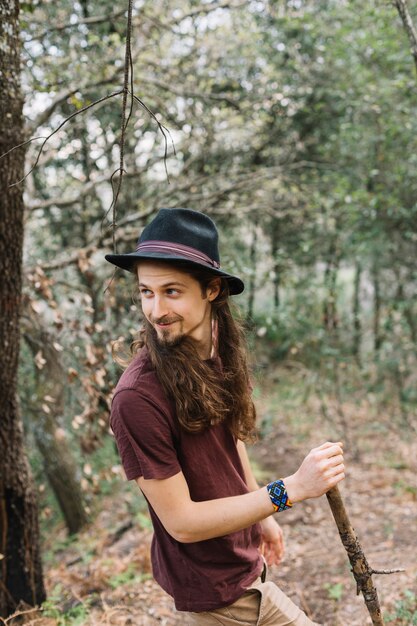 Man with long hair hiking in nature