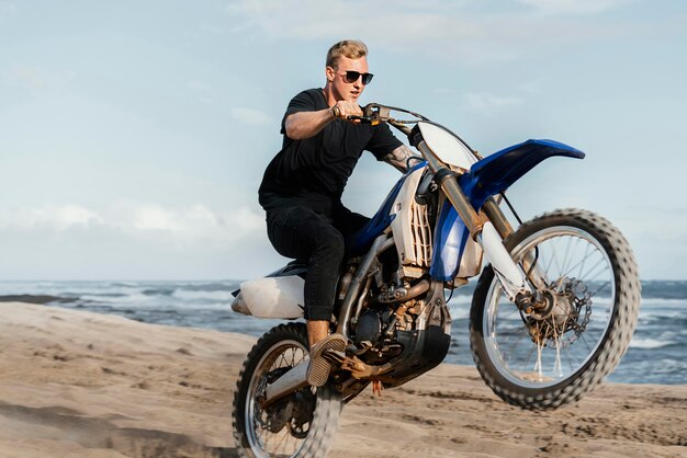 Man with motorcycle in hawaii