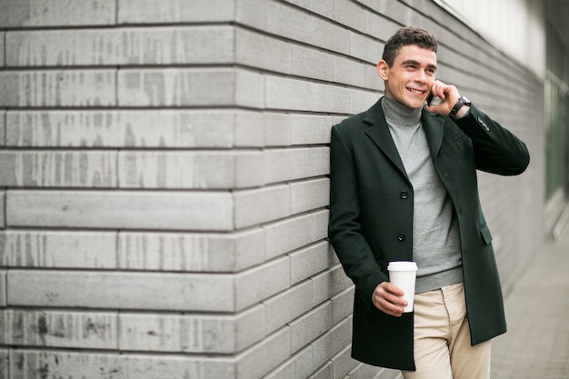 Man with phone in jacket