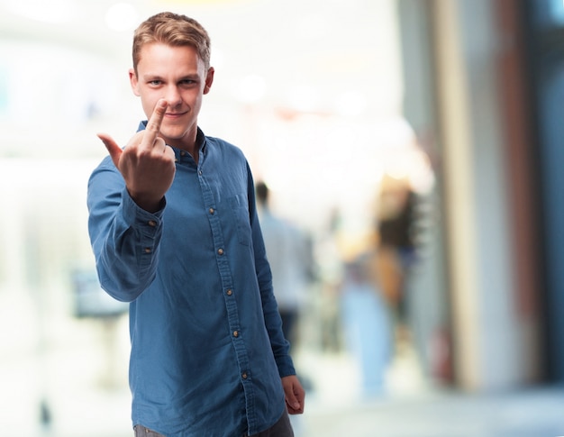 Man with raised heart finger