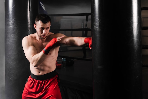 Free photo man with red gloves boxing