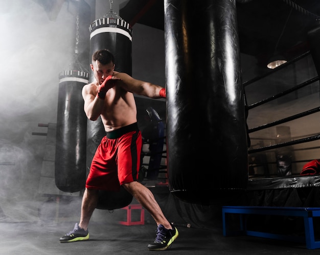 Man with red gloves training