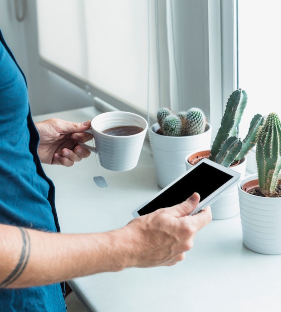 Man with smartphone and coffee