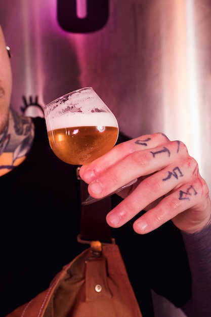 Man with tattoos producing craft beer