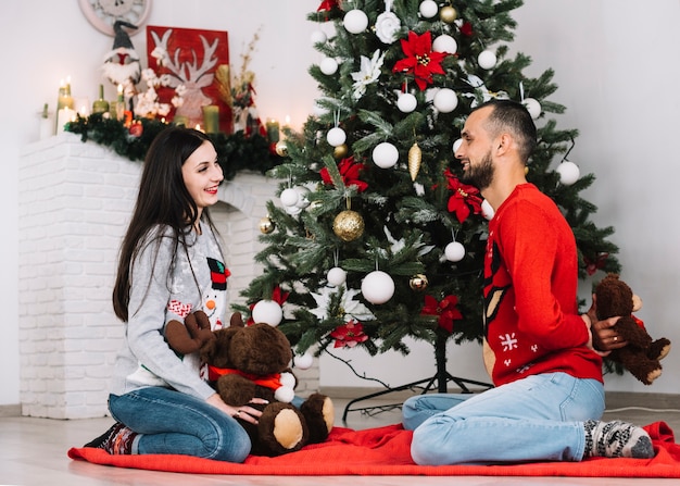 Man with teddy bear and woman with fluffy deer