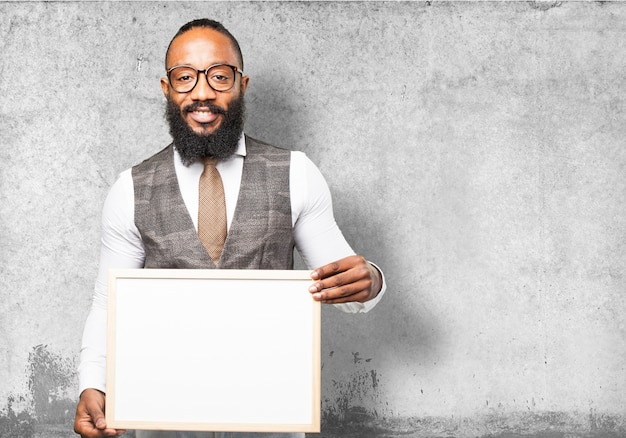 Free photo man with tie holding a white board