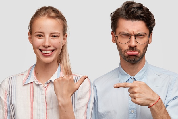 Man and woman in formal clothes posing