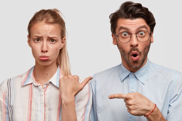 Man and woman in formal clothes posing