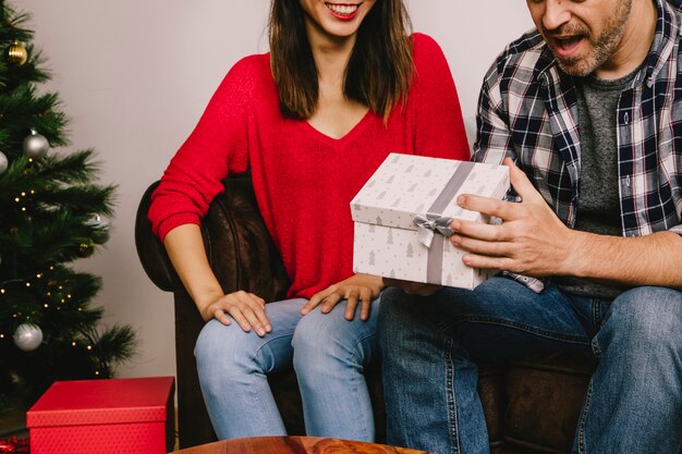 Man and woman gifting each other