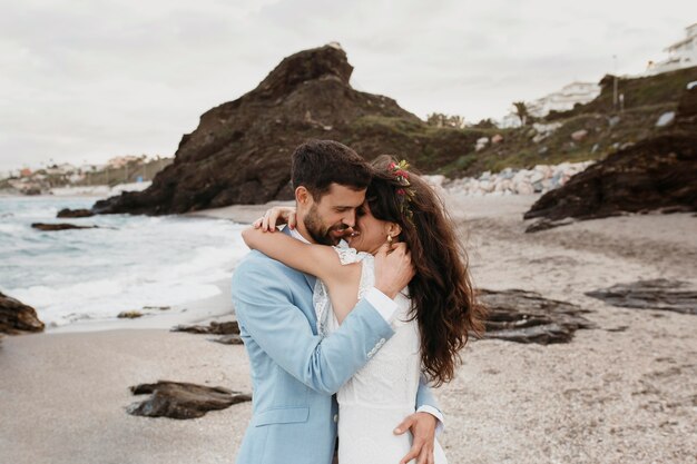 Man and woman having a beach wedding