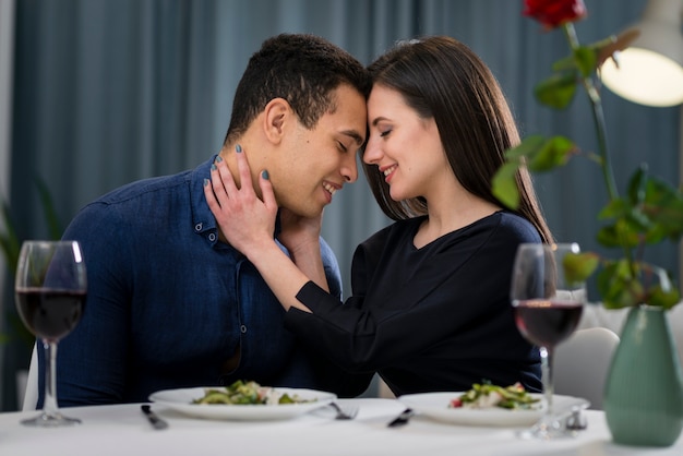 Man and woman having a romantic valentine's day dinner at home