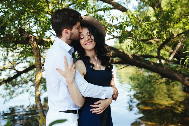 Man and woman at the lake to spend time in each other's arms