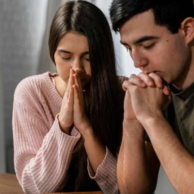 Man and woman praying together