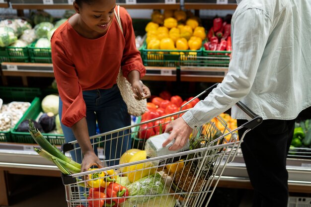 Man and woman shopping at the grocery store