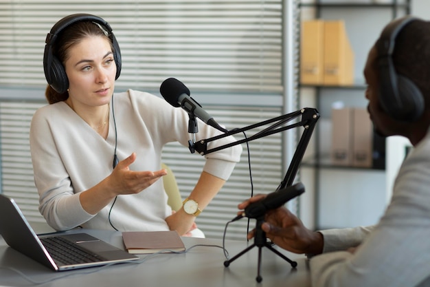 Man and woman talking in a podcast