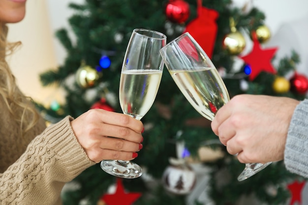 Man and woman toasting with champagne glasses