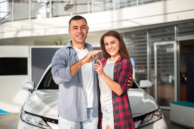 Man and woman together at car dealership