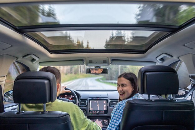 Man and woman traveling in car sitting in car driving to travel destination