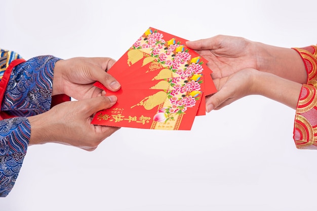 Free Photo the man and woman wear cheongsam with red gift money to send their family