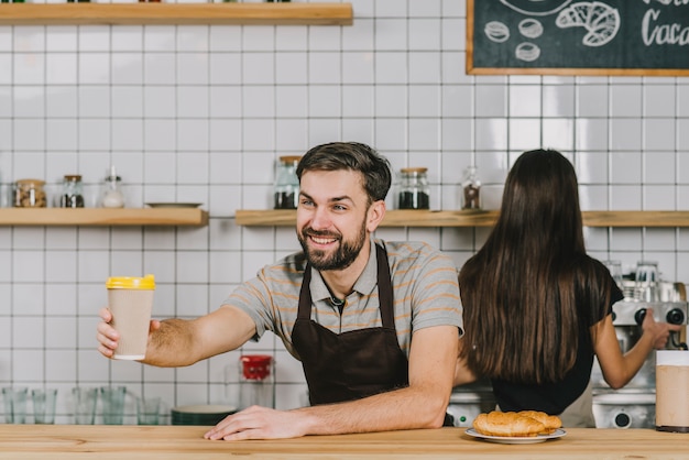 Man and woman working in cafe