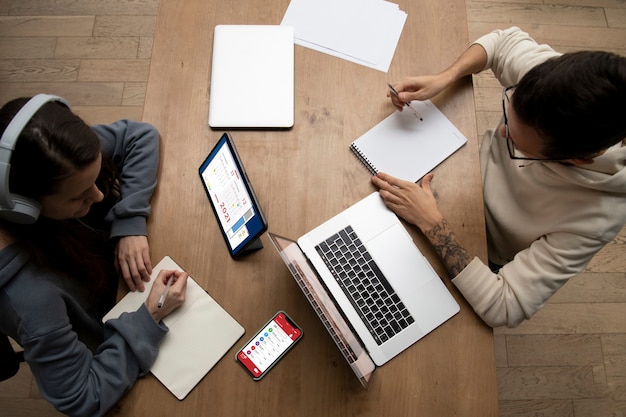 Man and woman working together from home at desk