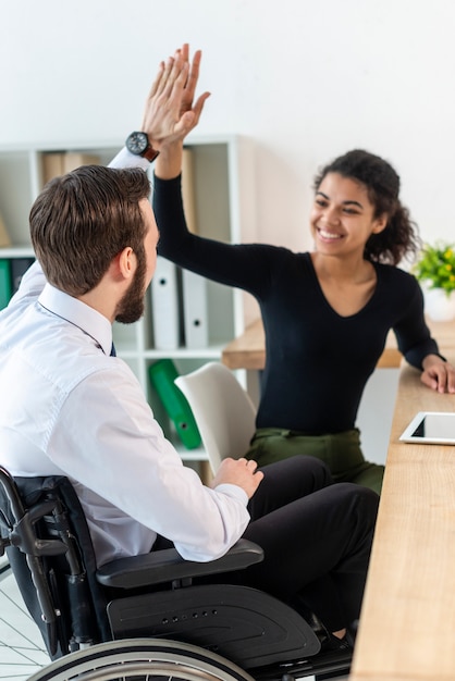 Man and woman working together at the office