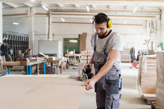 Man working on cutting mdf board