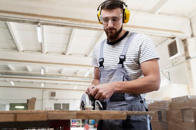 Man working on cutting mdf board