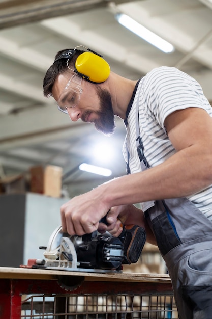 Man working on cutting mdf board