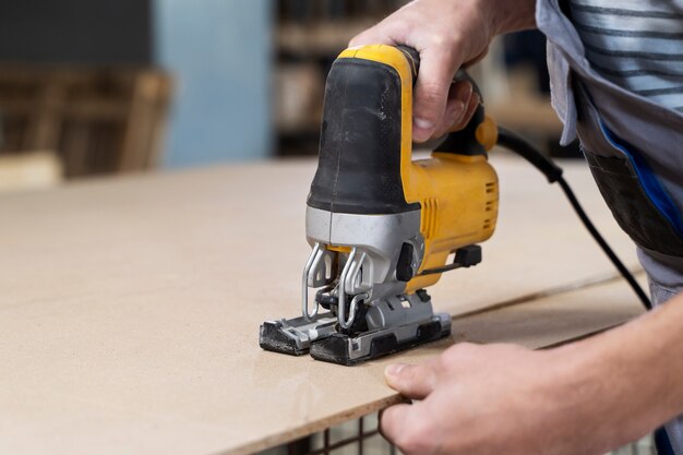 Man working on cutting mdf board